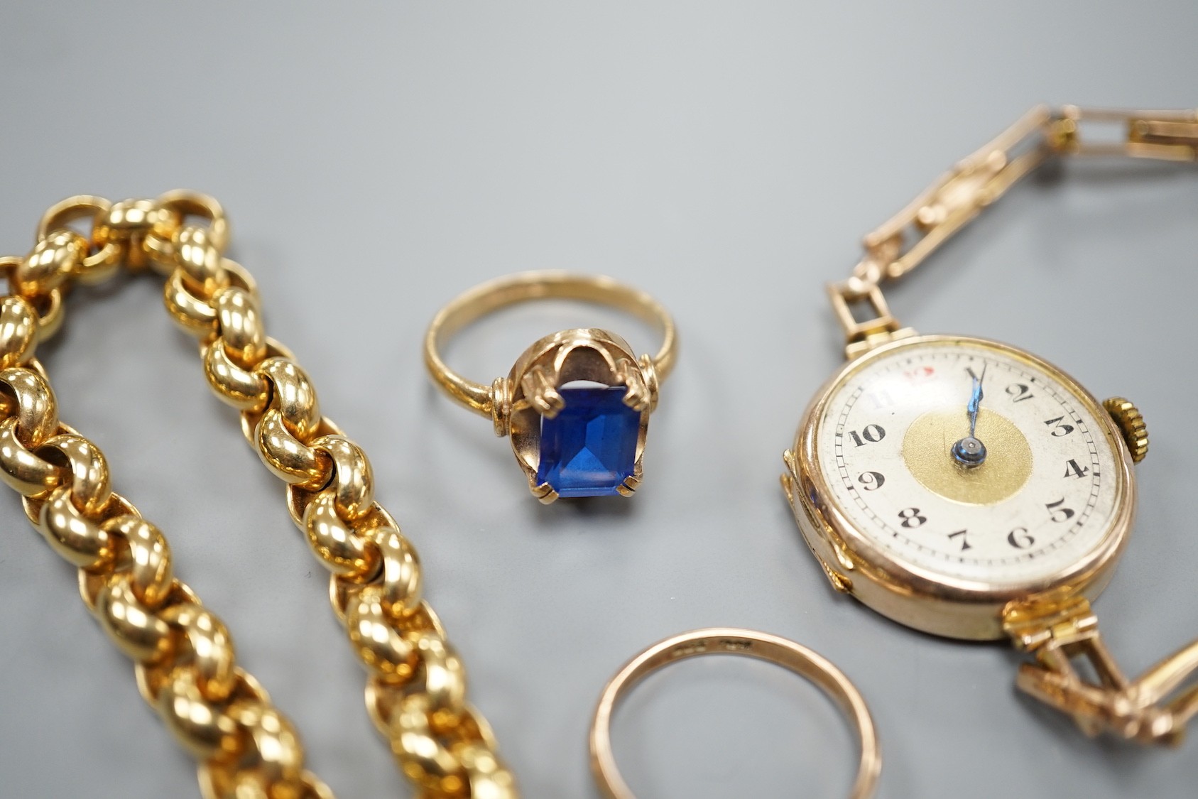 A modern 9ct gold bracelet, 18cm, 11.9 grams, two 9ct rings an a lady's 9ct gold manual wind wrist watch, on a 9ct bracelet, gross 20.7 grams.